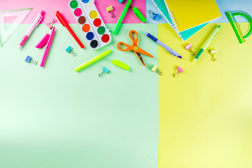 Colorful back to school background. Bright background with school supplies, stationery, pens, pencils, rulers, notebooks, copy space for text, whiteboard for notes, flat lay top view
