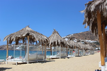 beach with chairs and umbrellas