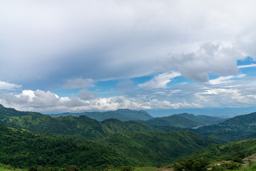 Blue sky high peak mountains fog hills mist scenery national park views at Phu Tub Berk, Khao Koh, Phetchabun Province, Thailand