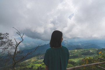 Happy young cute Asian Japanese girl hipster backpack women travelling looking at beautiful sky mountains scenery views 