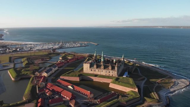 Aerial view of Kronborg Castle in Helsing&oslash;r, Denmark with drone flying backwards