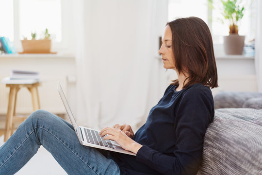 Woman working on a laptop computer at home