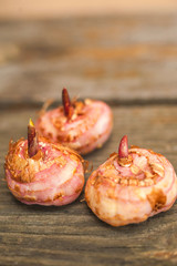 Three gladiolus bulbs close-up and copy space. Planting gladioli.