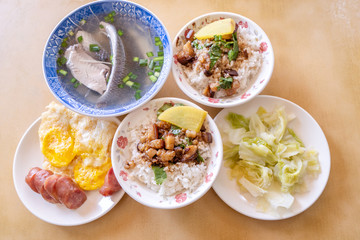Braised pork over rice - Taiwan famous traditional street food delicacy. Soy-stewed pork on rice. Travel design concept. Top view,copy space,close up