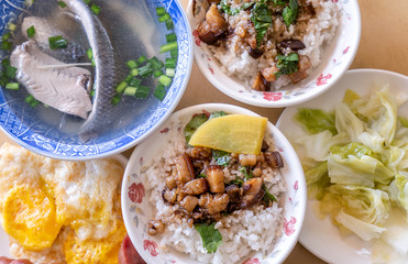 Braised pork over rice - Taiwan famous traditional street food delicacy. Soy-stewed pork on rice. Travel design concept. Top view,copy space,close up