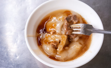 Bawan (Ba wan), taiwanese meatball delicacy, delicious street food, fried starch wrapped round shaped dumpling with pork inside, close up, copy space