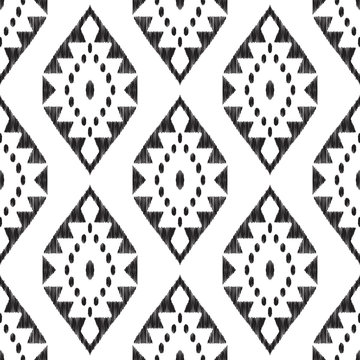 Ikat seamless pattern. Black and white ethnic background. Textured vector illustration in navajo, mexican, indian boho style. Usable for fabric, wallpaper, textile, surface print.
