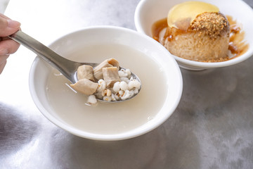 Four tonics soup, four ingredients herb flavor soup. Taiwanese delicious street food delicacy with Job's tears, pork intestines, close up, copy space