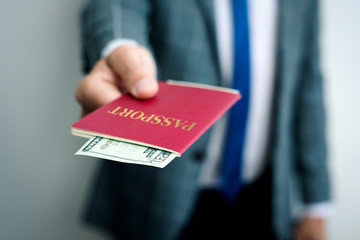 businessman with 20 dollars in his passport