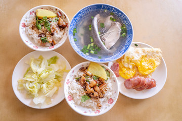 Braised pork over rice - Taiwan famous traditional street food delicacy. Soy-stewed pork on rice. Travel design concept. Top view,copy space,close up