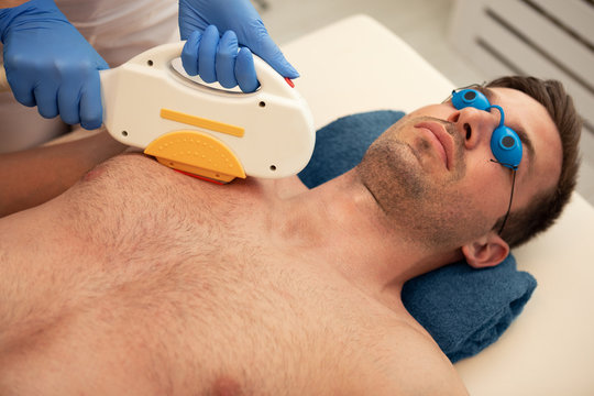 Laser Epilation Treatment To Man Chest