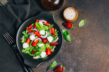 Strawberry salad with basil. Delicious vegetarian salad with strawberries.