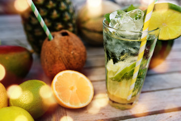Mojito cocktail and tropical fruits
