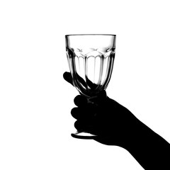 Hand holds a glass on a white background. isolate. Siluet