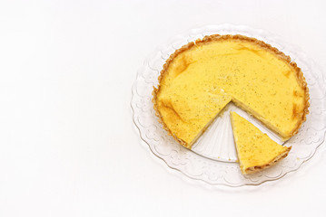Sweet custard tart or lemon pie white background. Selective focus. Close up. Copy space.