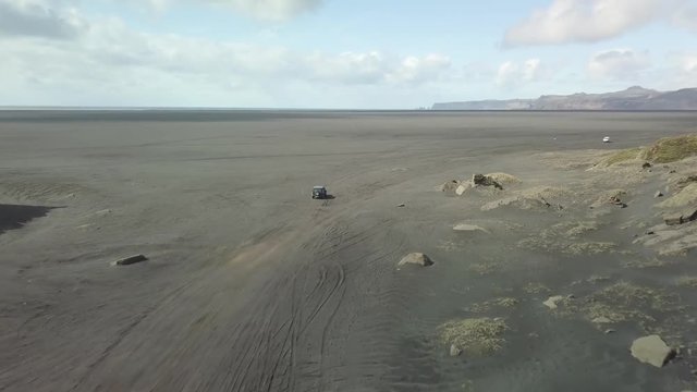 Driving on black sand drone footage