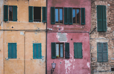 Fototapeta na wymiar windows characteristic of the houses of Siena