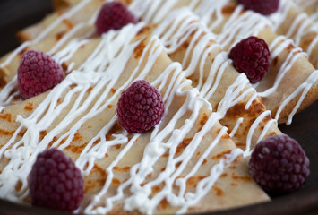 Pancakes with sour cream and raspberry. Delicious home breakfast. 