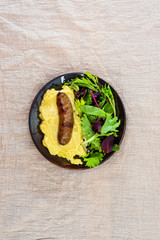 Mashed potato with cream, butter and emmental, grilled sausage