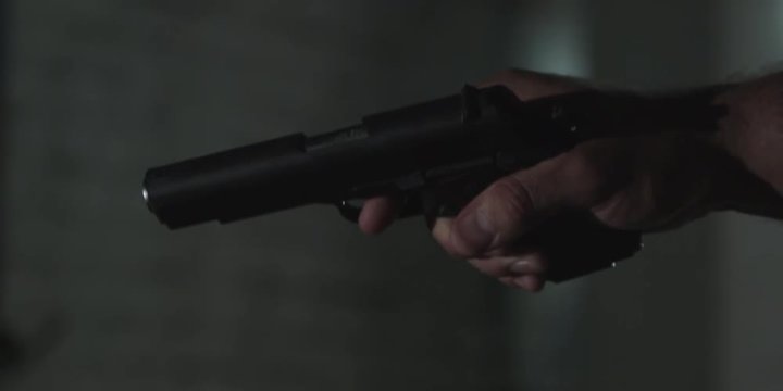 hand with a gun