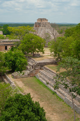 Mayan ruins of the archaeological area of Uxmal, in the Mexican peninsula of Yucatan, with the Great Pyramid in the background