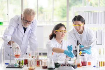 Male and female scientists are testing and analyzing to find the results of research, Scientific and chemical concepts
