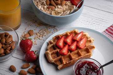 Belgian waffle. Delicious oatmeal or granola on breakfast. Morning sweet food. Strawberry lunch. Homemade cake
