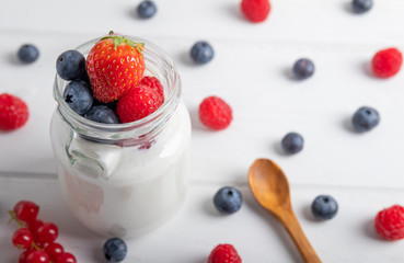 yogurt with fruit on a breakfast table on a white background