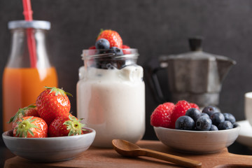 yogurt with fruit on a breakfast table