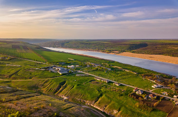 Fototapeta na wymiar Arial view over the river and small village.