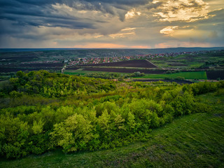 Fototapeta na wymiar Flight over cultivating field in the spring at sunset. Moldova Republic of.