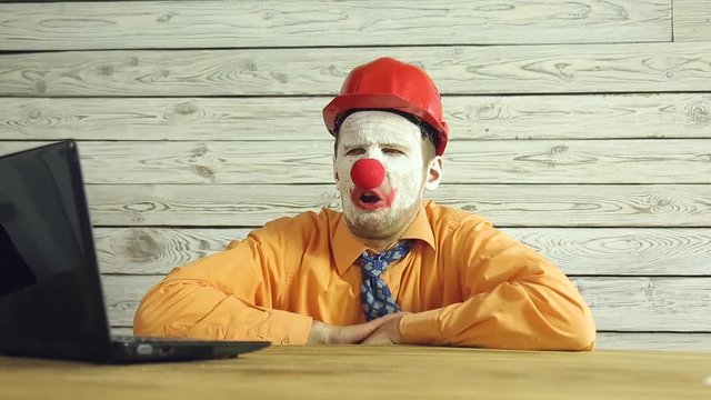 Clown businessman working in the office
