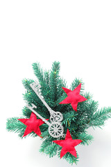 Christmas arrangement of branches of spruce and toys in the form of keys and stars. Flat lay, top view, vertical frame