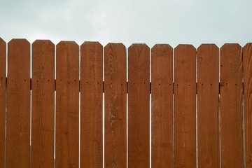 Brown fence wooden protect home from thief.