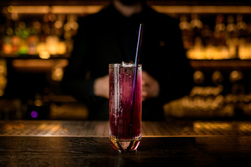 Close-up of purple cocktail on bar counter