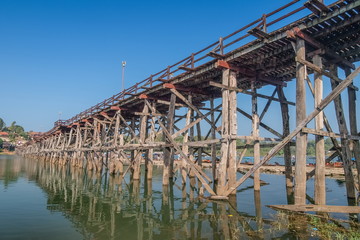 view of Mon bridge with blue sky background know as wooden bridge longest in Thailand, Sangklaburi, Kanchanaburi, Thailand.