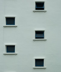 small window on the white building facade