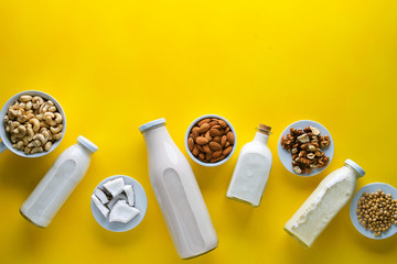 many kinds of vegetable milk in glass jars