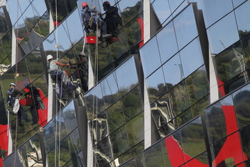 Fototapeta premium Cleaners working at height