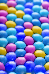 Texture-background of multicolored candies. Colors of the rainbow close-up, texture and repeating of the dragee
