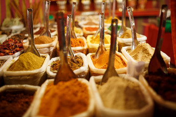 Colorful spices in bags at a market in Goa