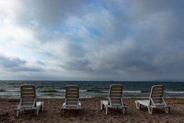 chaise lounges on the sea
