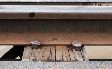 Closeup of the railway and metal peg.