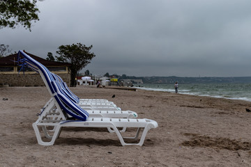 Fototapeta na wymiar two chairs and umbrella on the beach