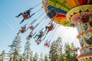 Kouvola, Finland - 18 May 2019: Ride Swing Carousel in motion in amusement park Tykkimaki and...