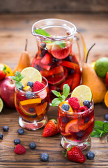 Summer cold cocktail, Sangria drink with fruit 