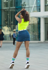 Fototapeta premium Young cool black skin girl walking in the street