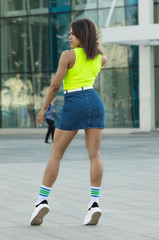 Fototapeta premium Young cool black skin girl walking in the street