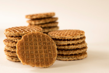 heap stroopwafels, syrup waffle, against white background. caramel cookie from The Netherlands