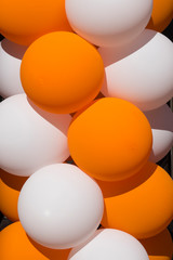 white and orange balloons